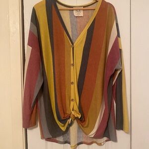 Colorful shirt with long sleeves that tie in the front.